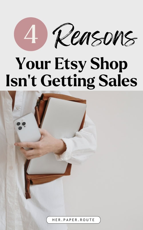 woman with phone and laptop thinking about why etsy shop gets no sales
