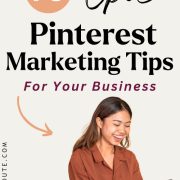 smiling woman looking up the best pinterest marketing tips on her phone