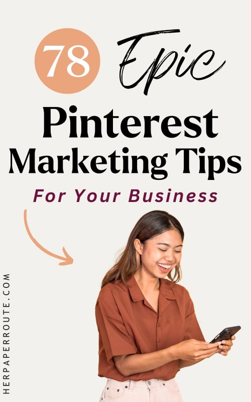 smiling woman looking up the best pinterest marketing tips on her phone