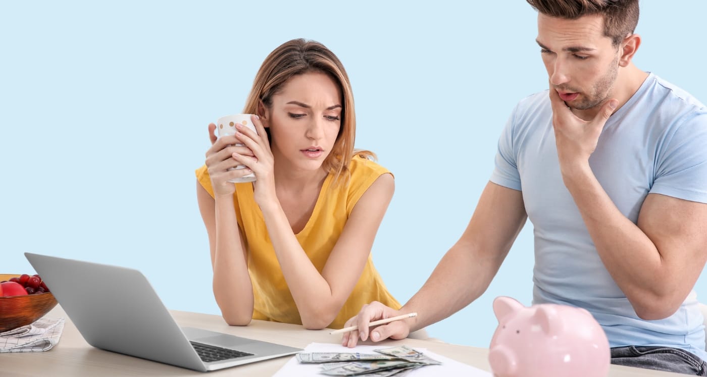 young couple learning Couple Money Management Tips to practice healthy finaces together