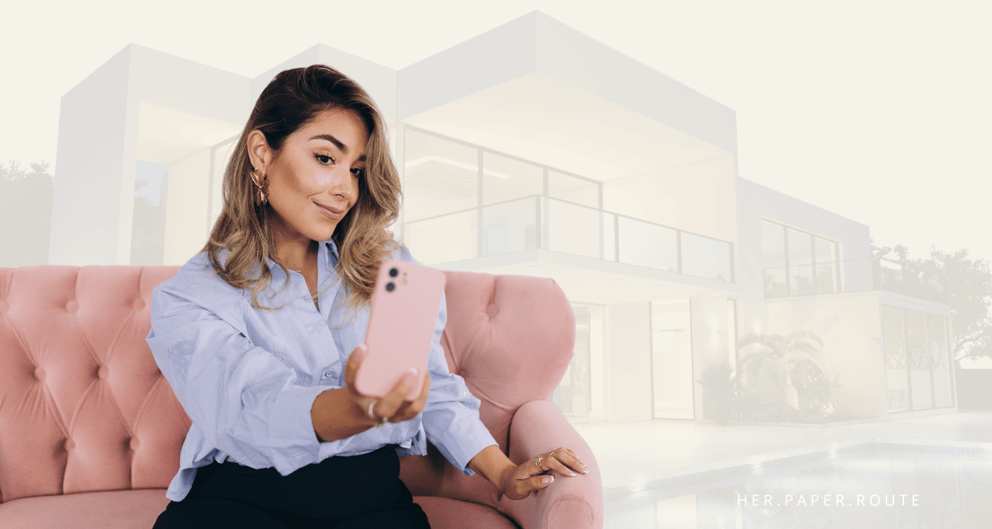 Millionaire woman sitting on couch taking selfie, explaining How To Become A Millionaire From Nothing