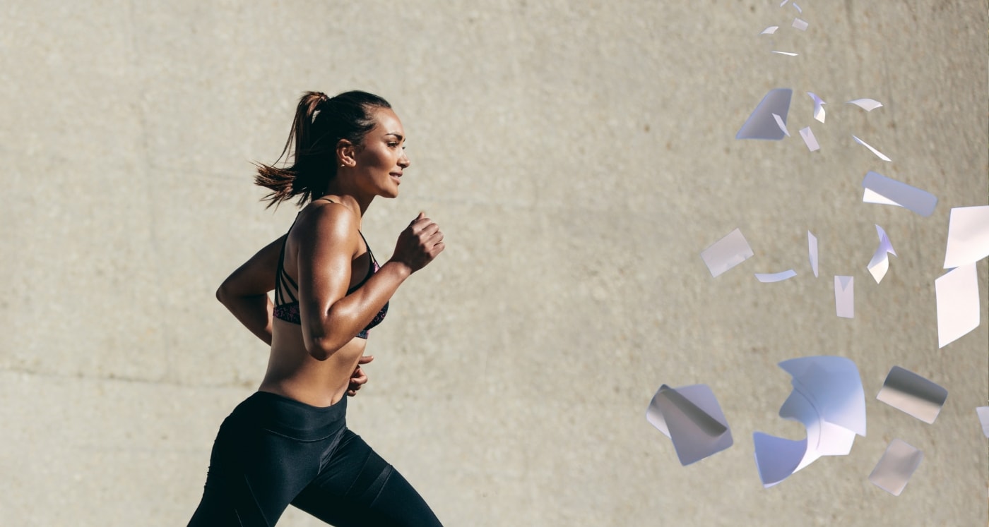 woman running towards bills illustrating How To Catch Up On Bills When You Fall Behind
