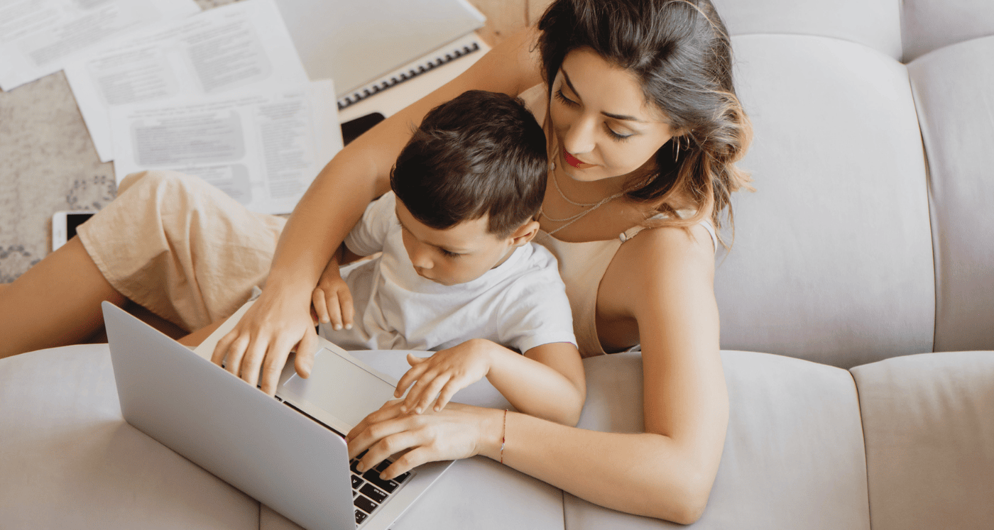 mother and son look at computer discovering How To Raise Kids To Be Responsible With Money