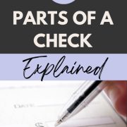 person signing a check showing the different parts of a check