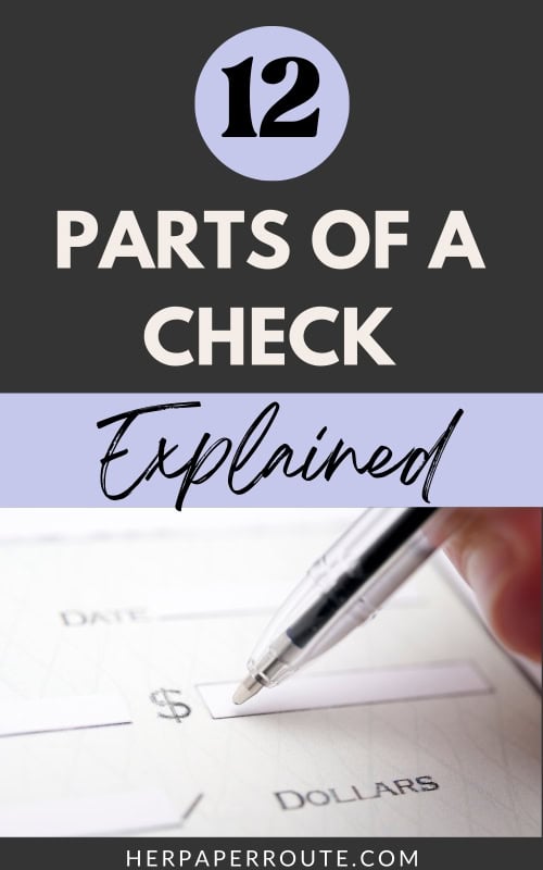 person signing a check showing the different parts of a check