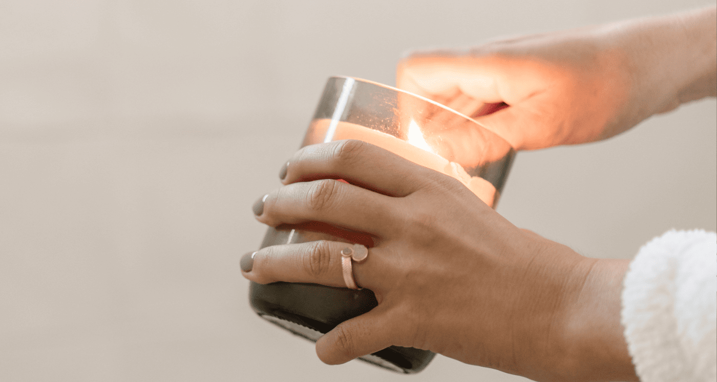 lighting a candle to practice some Financial Self-Care Tips