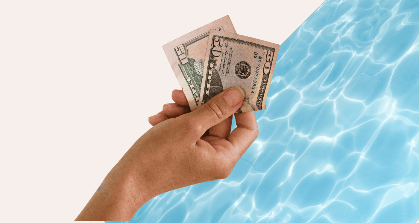 hand holding cash by swimming pool What is Your Liquid Net Worth