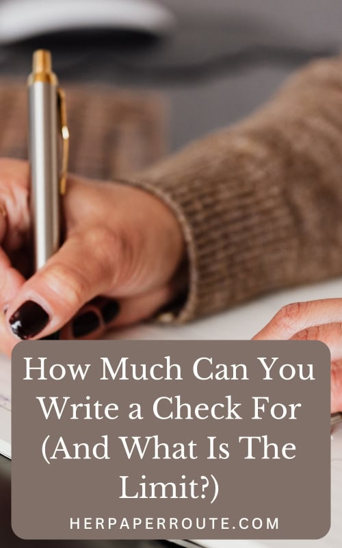 woman writing a check answering the question how much can you write a check for