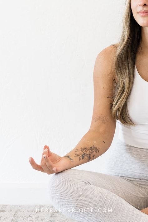 woman meditating as part of her daily blogger routine