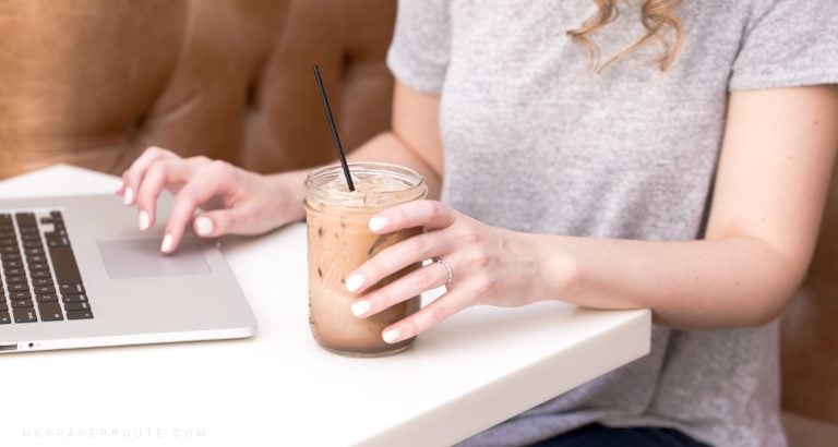 Woman holding iced coffee, learning the skills to know How To Monetize And Sell Website In 6 Months
