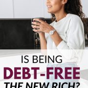 woman in her kitchen with a cup of coffee wondering is being debt free the new rich
