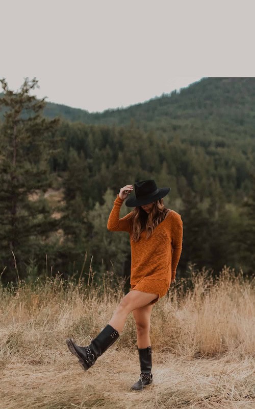 woman walks in field wearing orange dress as she learns about Fall Fashion Trends ~ Content Ideas