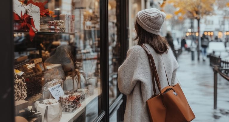 frugal woman gazes into shop window practicing genius ways to live frugally