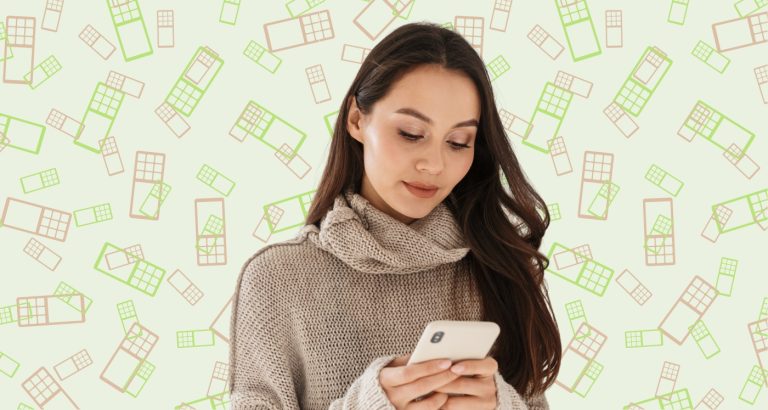 woman looks at her phone and learns Why Home-Based Business Owners Are Switching to This Virtual Phone System