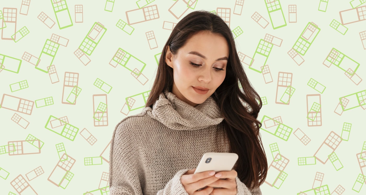 woman looks at her phone and learns Why Home-Based Business Owners Are Switching to This Virtual Phone System