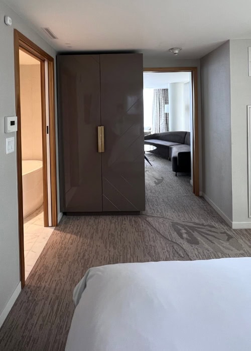 JW Parq Vancouver Review 3 Luxury hotel room at JW Parq Vancouver with modern design and cozy seating area.